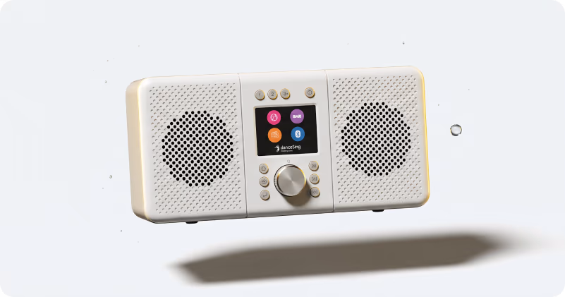 The danceSing radio unit, a compact white internet radio with dual speakers and a colour display